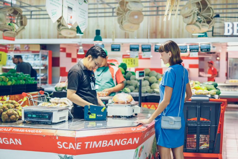 BALI, INDONESIA - OCTOBER 2, 2017: Young woman at supermarket Bali Gallery, Bali island