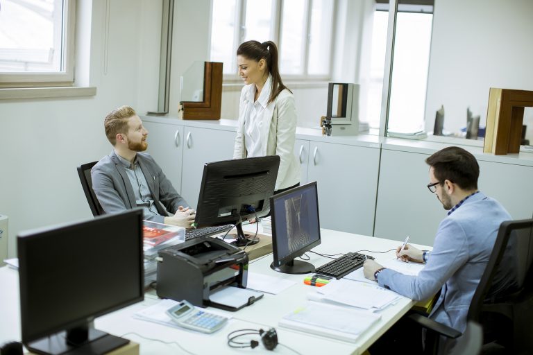 Group of young people working in the modern office